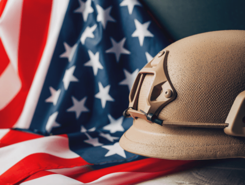 American Flag on left side with Beige Military Helmet on right side
